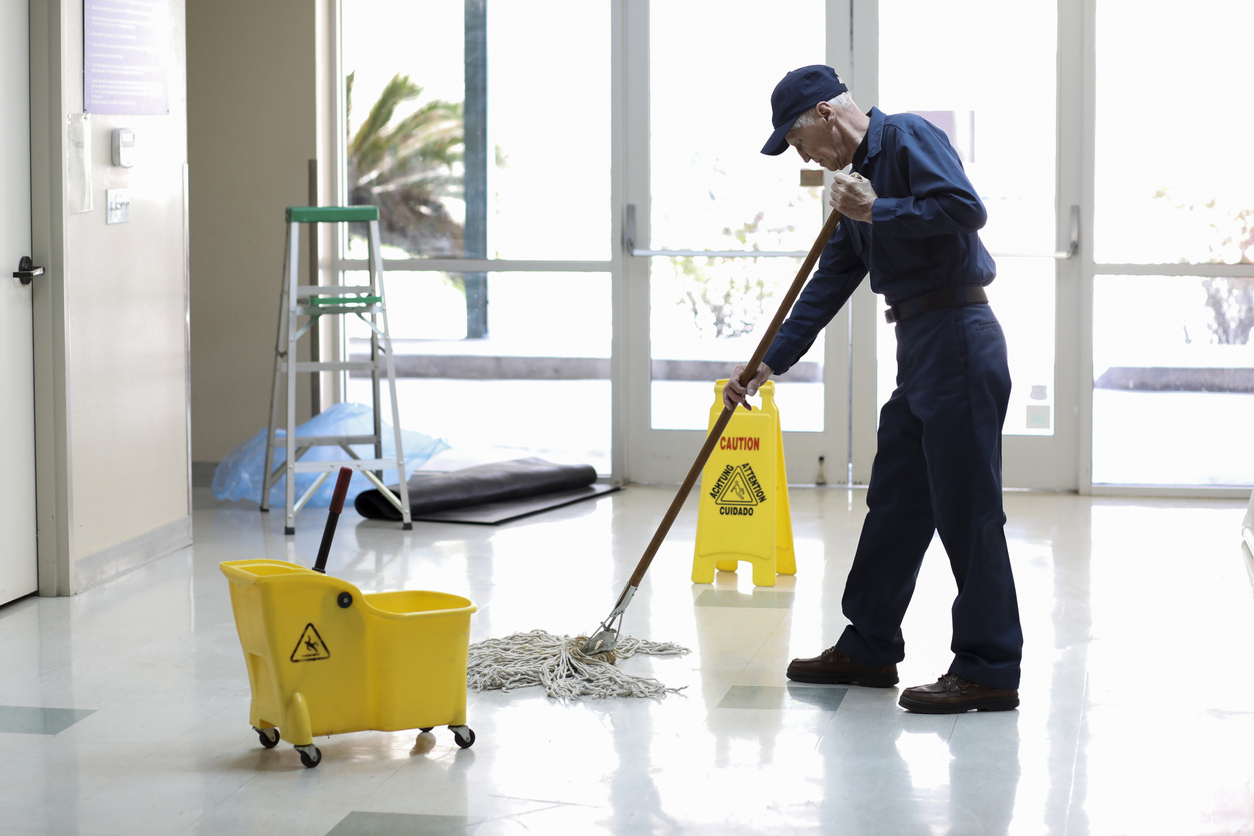 janitor cleaning the floor